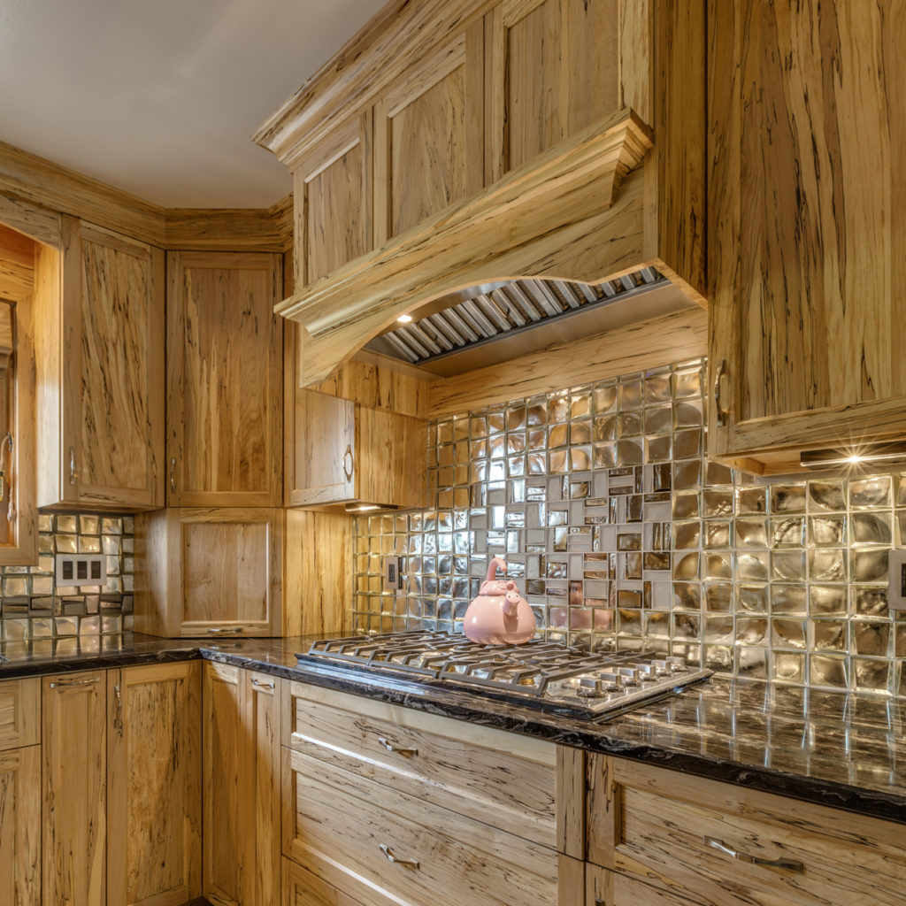 Crossville Sideview Gold Mosiac's add a lavish finish on this kitchen's backsplash. (Source: Crossville)