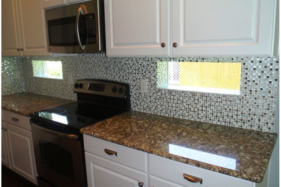 The Mini Metallic Glass and Stone Foil Square Mosaic available at Custom Home Interiors! 