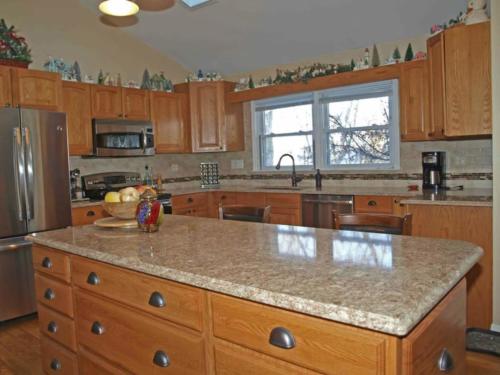 Daltile subway tiles with a glass and stone border